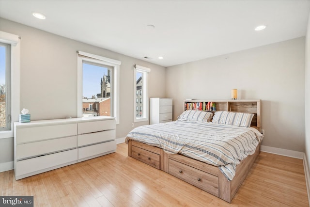 bedroom with light hardwood / wood-style floors