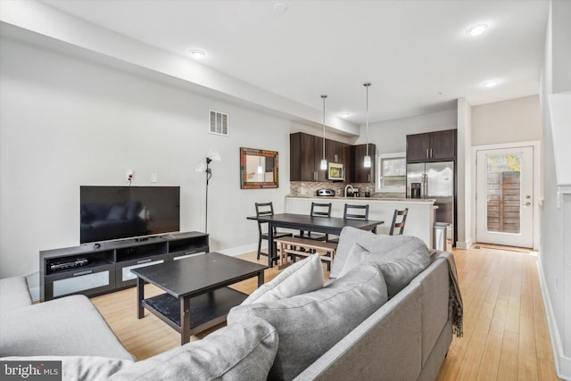 living room with light hardwood / wood-style floors