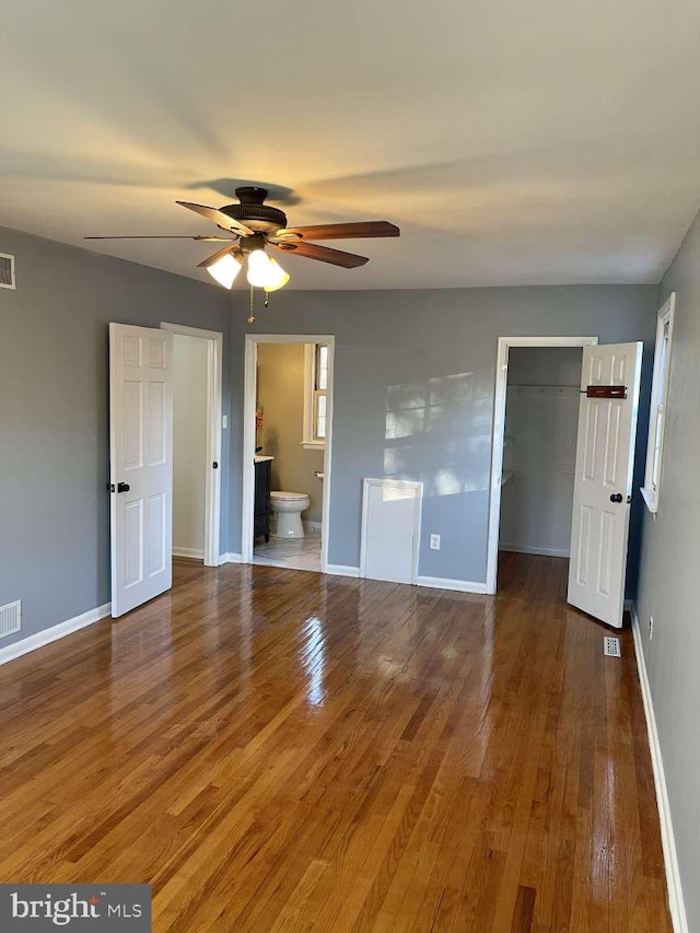 unfurnished room with hardwood / wood-style floors and ceiling fan