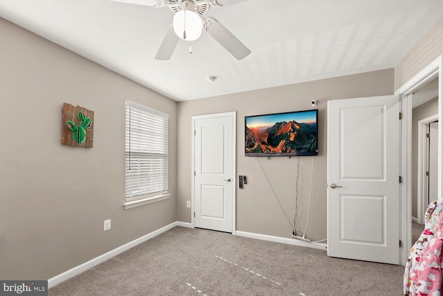 unfurnished bedroom with carpet and ceiling fan