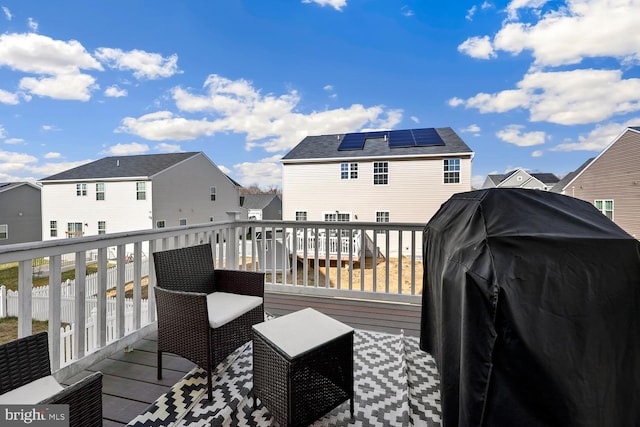 wooden terrace featuring grilling area