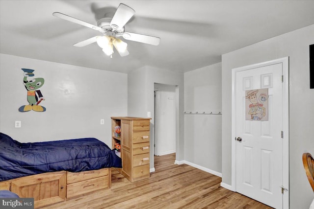 bedroom featuring wood-type flooring and ceiling fan