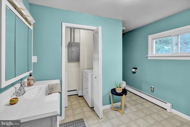 bathroom featuring electric panel, baseboard heating, and sink