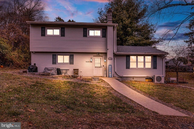 view of front of house with a lawn