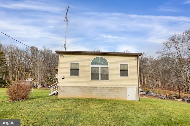 view of home's exterior featuring a yard