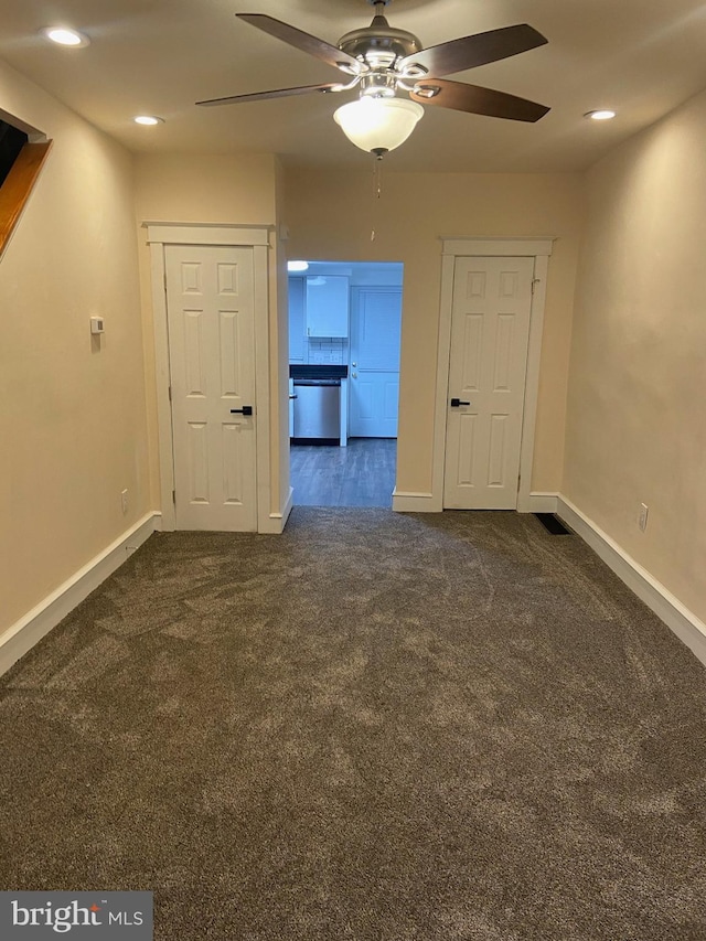 carpeted empty room with ceiling fan