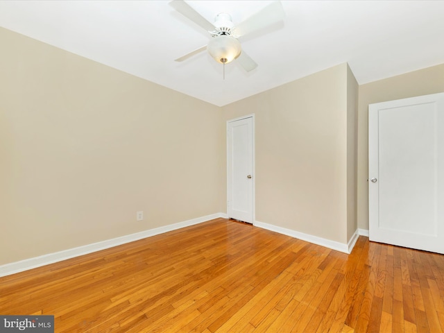 unfurnished room with ceiling fan and light hardwood / wood-style flooring