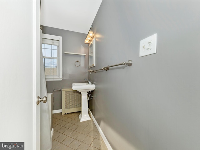 bathroom featuring tile patterned flooring and sink