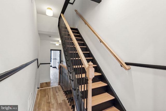 staircase featuring hardwood / wood-style floors