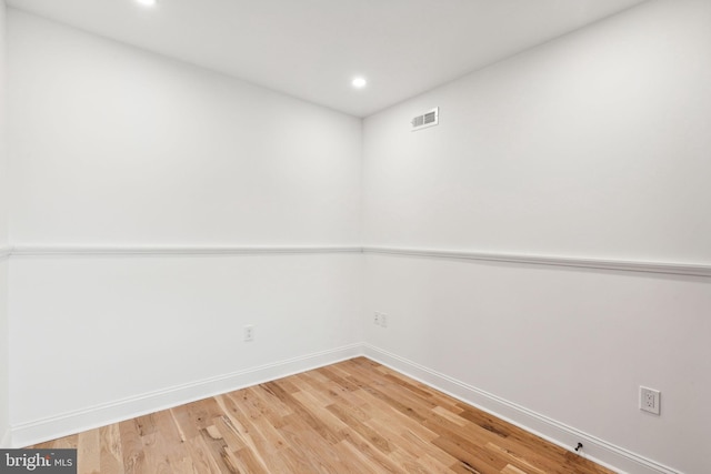 unfurnished room featuring hardwood / wood-style floors