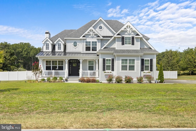 craftsman inspired home with a porch and a front yard