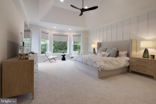 bedroom with ornamental molding, a towering ceiling, light carpet, and ceiling fan