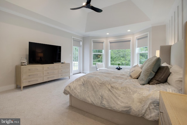 carpeted bedroom with access to exterior, ornamental molding, ceiling fan, and a high ceiling