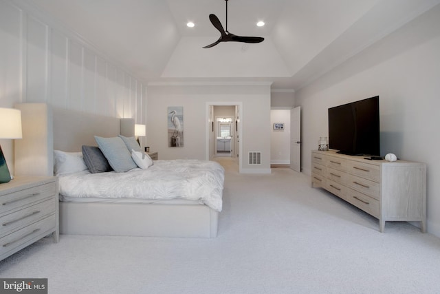 bedroom with ceiling fan, light colored carpet, and a high ceiling