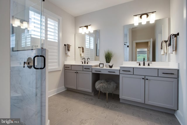 bathroom featuring vanity and a shower with shower door