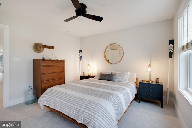 bedroom featuring ceiling fan and light colored carpet