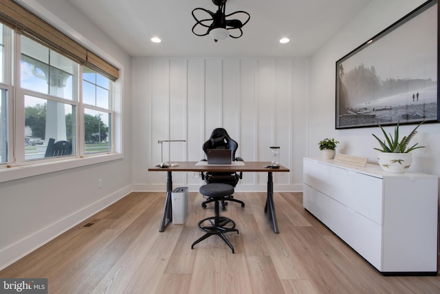 office space with light hardwood / wood-style flooring