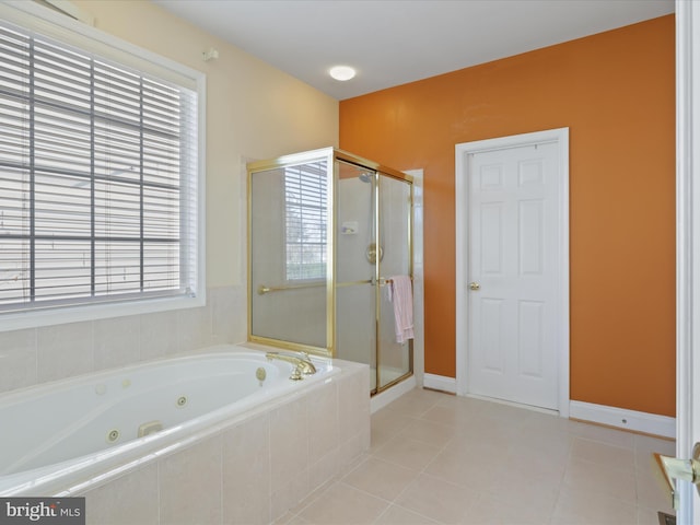 bathroom with tile patterned floors and plus walk in shower