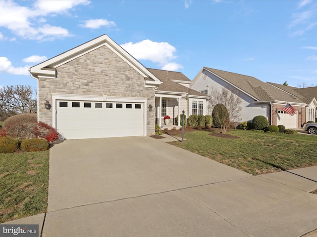 view of front of house with a front lawn and a garage