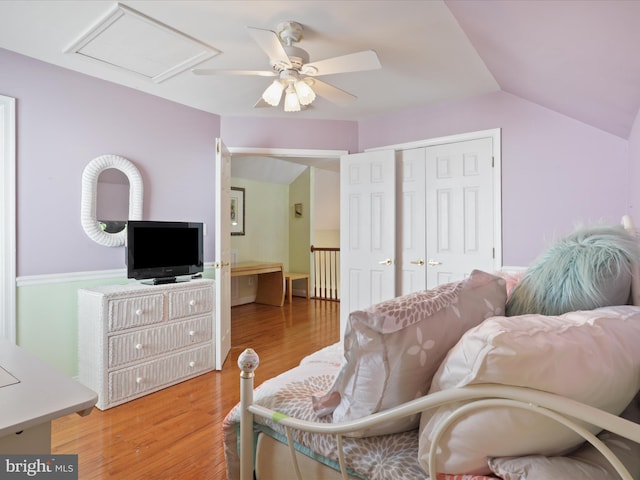 sitting room with vaulted ceiling, hardwood / wood-style floors, and ceiling fan