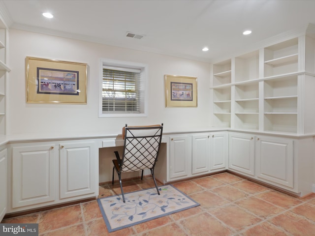 office area with crown molding, built in desk, and built in features