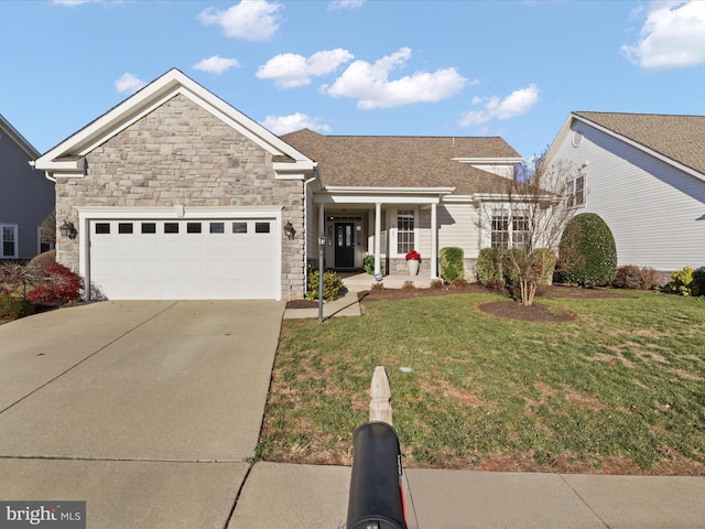 view of front of home featuring a garage, a front lawn, and a porch