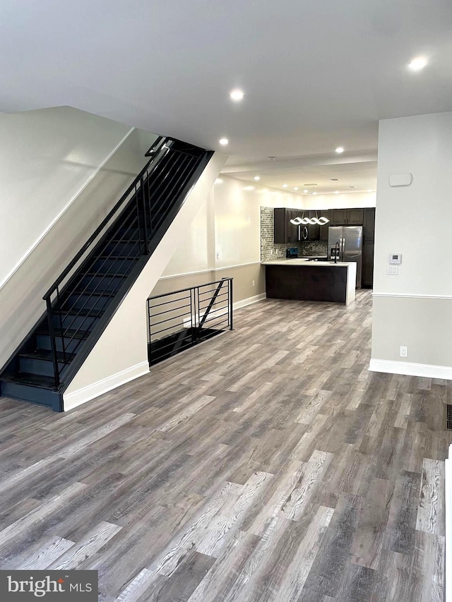 unfurnished living room with hardwood / wood-style floors