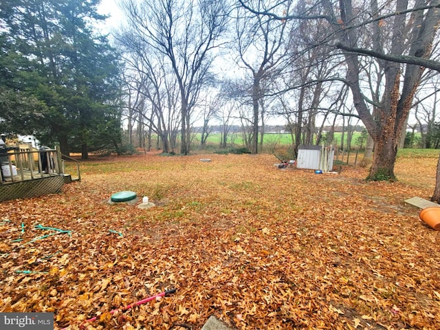 view of yard featuring a wooden deck