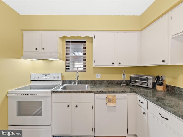 kitchen featuring white appliances, white cabinetry, and sink