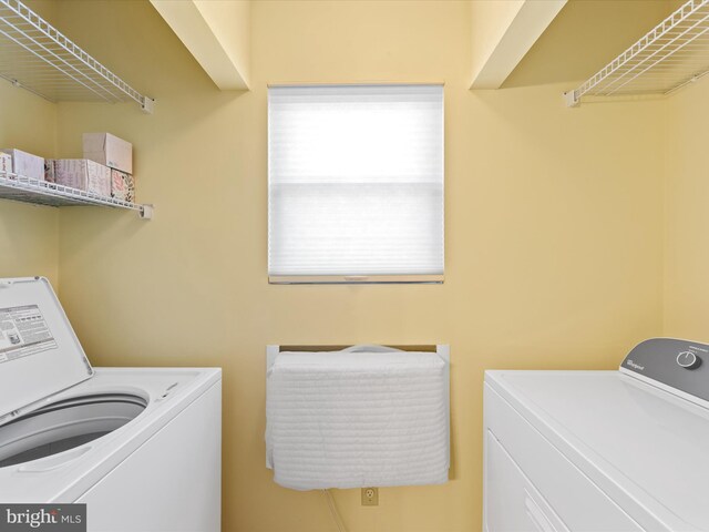 laundry area with washer and clothes dryer