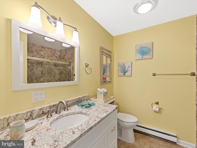 bathroom with vanity, a shower with door, toilet, and baseboard heating