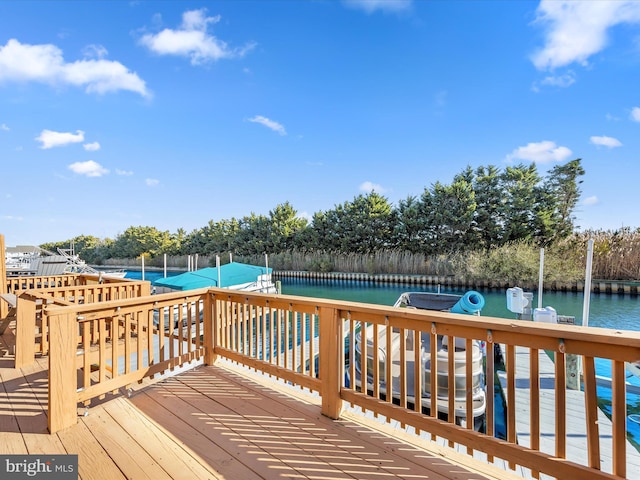 wooden deck with a water view