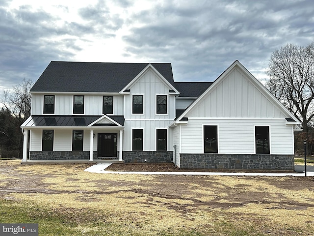 modern inspired farmhouse with covered porch