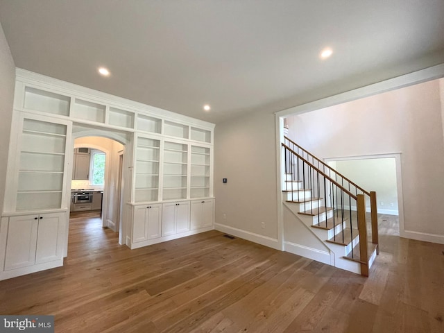 spare room with hardwood / wood-style flooring