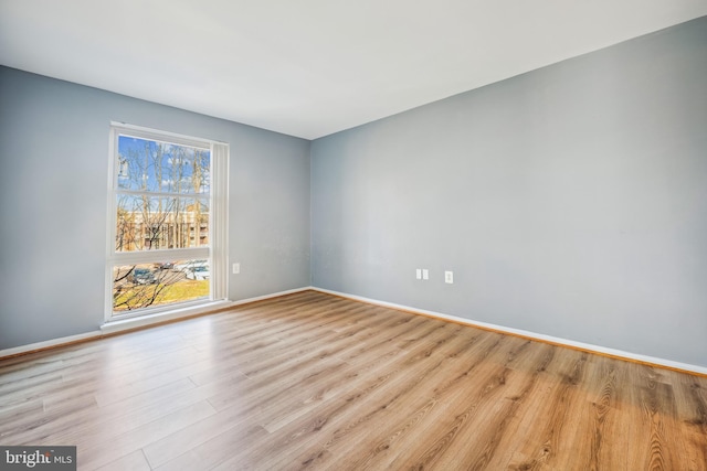 spare room with light hardwood / wood-style floors