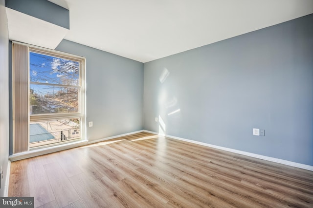 empty room with light wood-type flooring