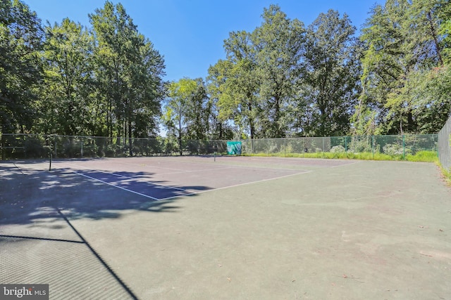 view of sport court with basketball hoop