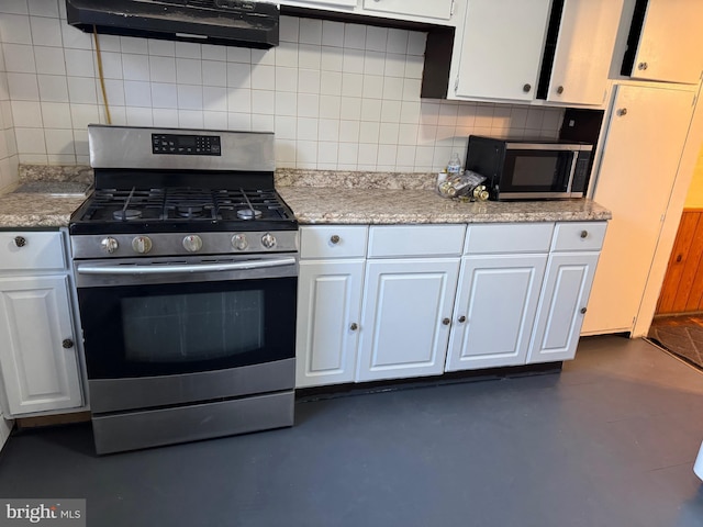 kitchen with ventilation hood, backsplash, white cabinetry, and stainless steel appliances