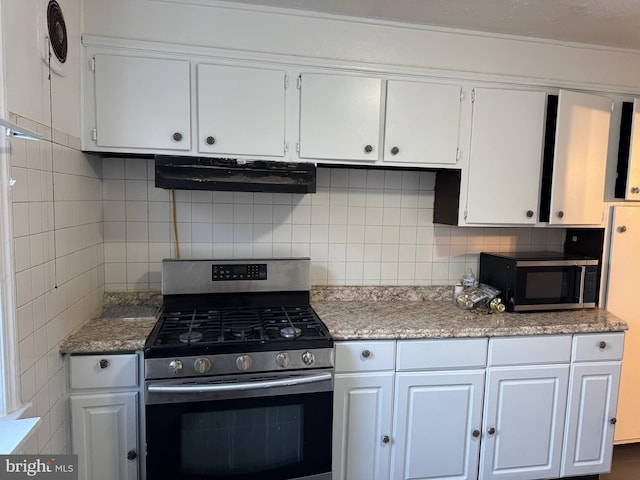 kitchen featuring white cabinets, backsplash, and stainless steel appliances