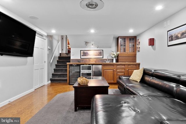 living room with hardwood / wood-style floors and beverage cooler