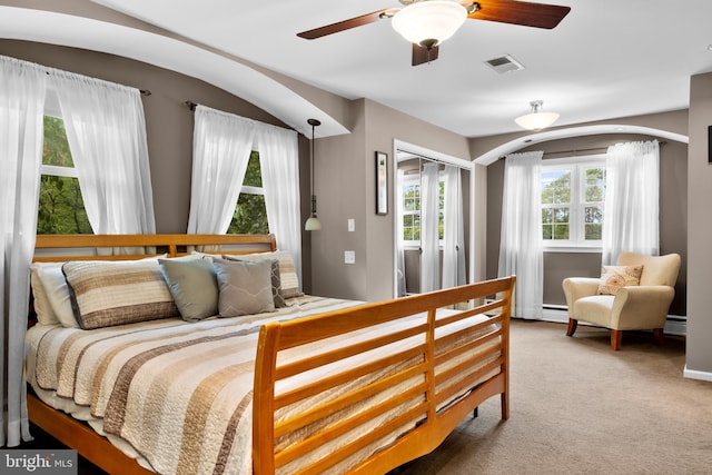 carpeted bedroom featuring ceiling fan and a closet