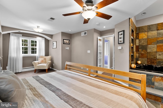 bedroom with baseboard heating and ceiling fan