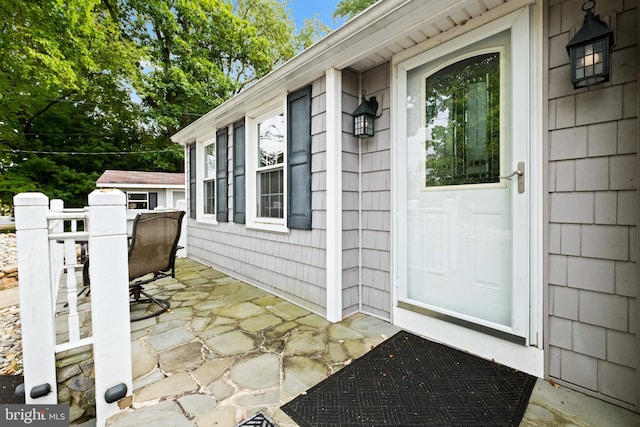 doorway to property with a patio area