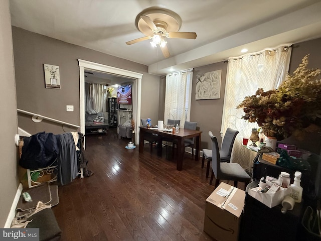 dining space with dark hardwood / wood-style floors and ceiling fan