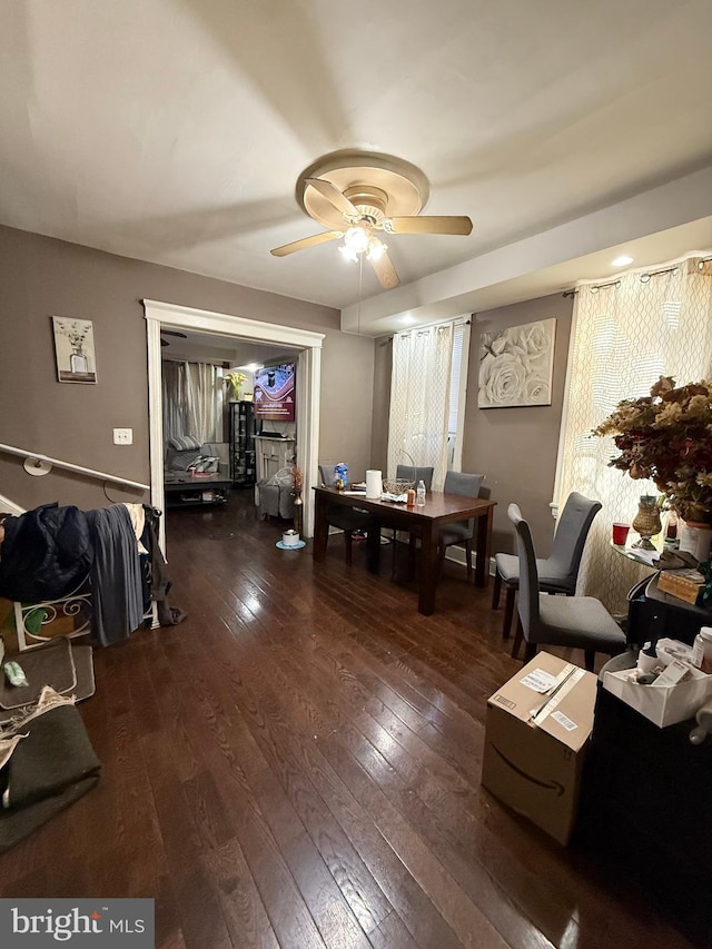 dining space featuring dark hardwood / wood-style floors and ceiling fan