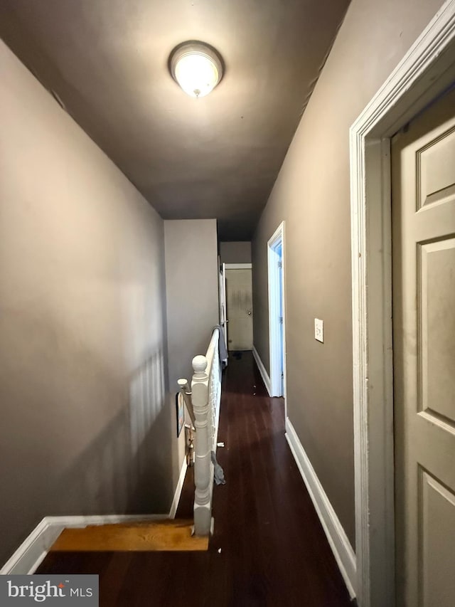 hall with dark hardwood / wood-style floors