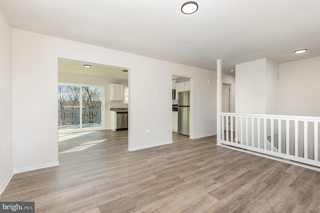 unfurnished room with light hardwood / wood-style flooring