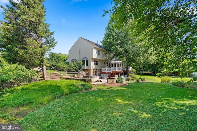 view of yard featuring a deck and a patio