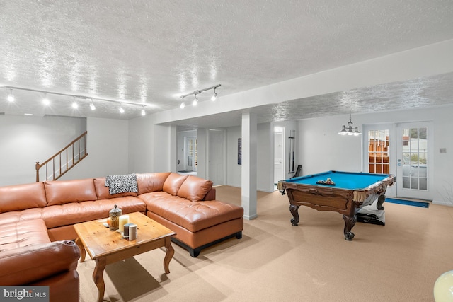 playroom featuring a textured ceiling, track lighting, and pool table