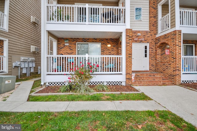 doorway to property with an AC wall unit